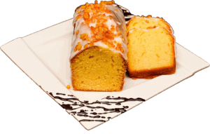 BABKA CYTRYNOWA - Ciasto piaskowe z aromatem cytrynowym oblane pomadą i obsypane skórką pomarańczową.