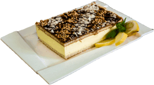 CYTRYNOWA ROZKOSZ - Jasny biszkopt z pianką cytrynową i warstwą karmelu posypany orzechami oraz płatkami migdałów.