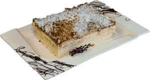 TOFFIK - Jasny biszkopt przełożony kremem budyniowym, herbatnikami i kremem śmietankowym udekorowany karmelem.